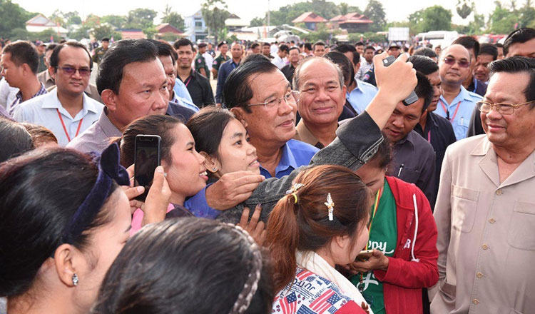 Khmer Times: Worker benefits here to stay, PM says